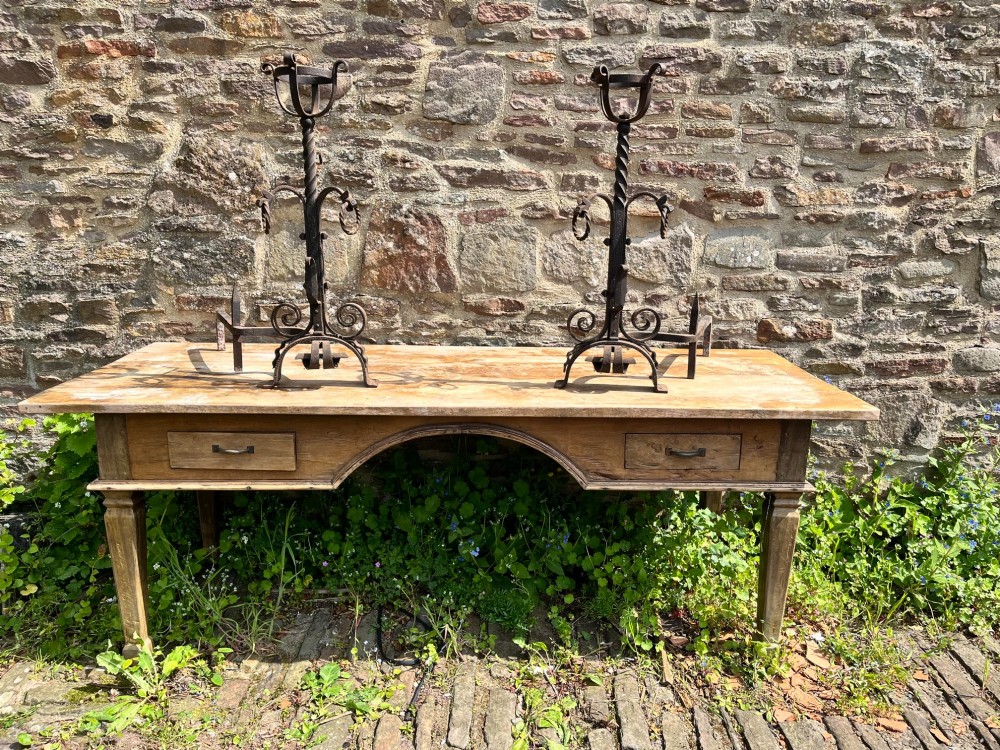 Pair of antique hand-forged wrought iron firedogs featuring barley twist stems, cresset basket tops, scrolled feet, and rear log rests. View IV