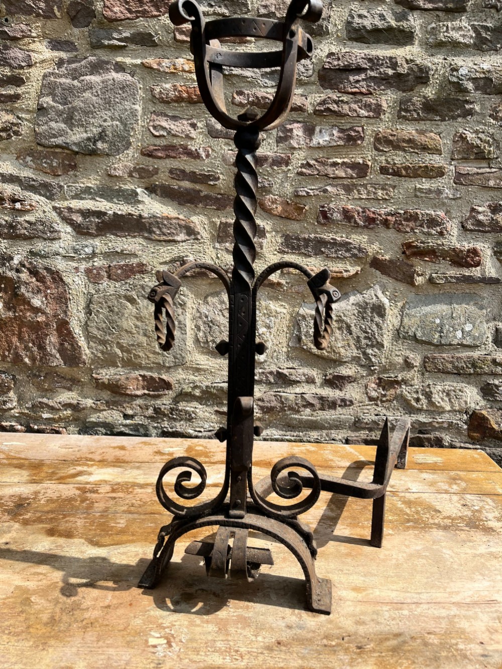 Pair of antique hand-forged wrought iron firedogs featuring barley twist stems, cresset basket tops, scrolled feet, and rear log rests. View V