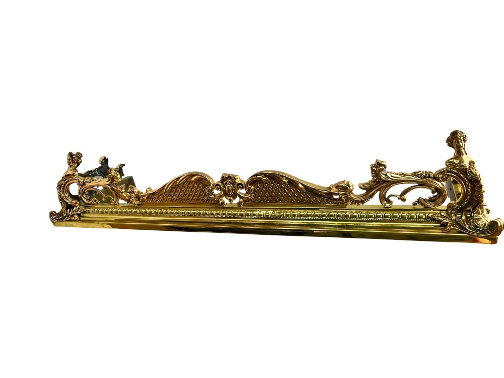 An ornate brass and bronze fireplace fender featuring Rococo scrollwork, lattice panels, and female figural end ornaments. View IV