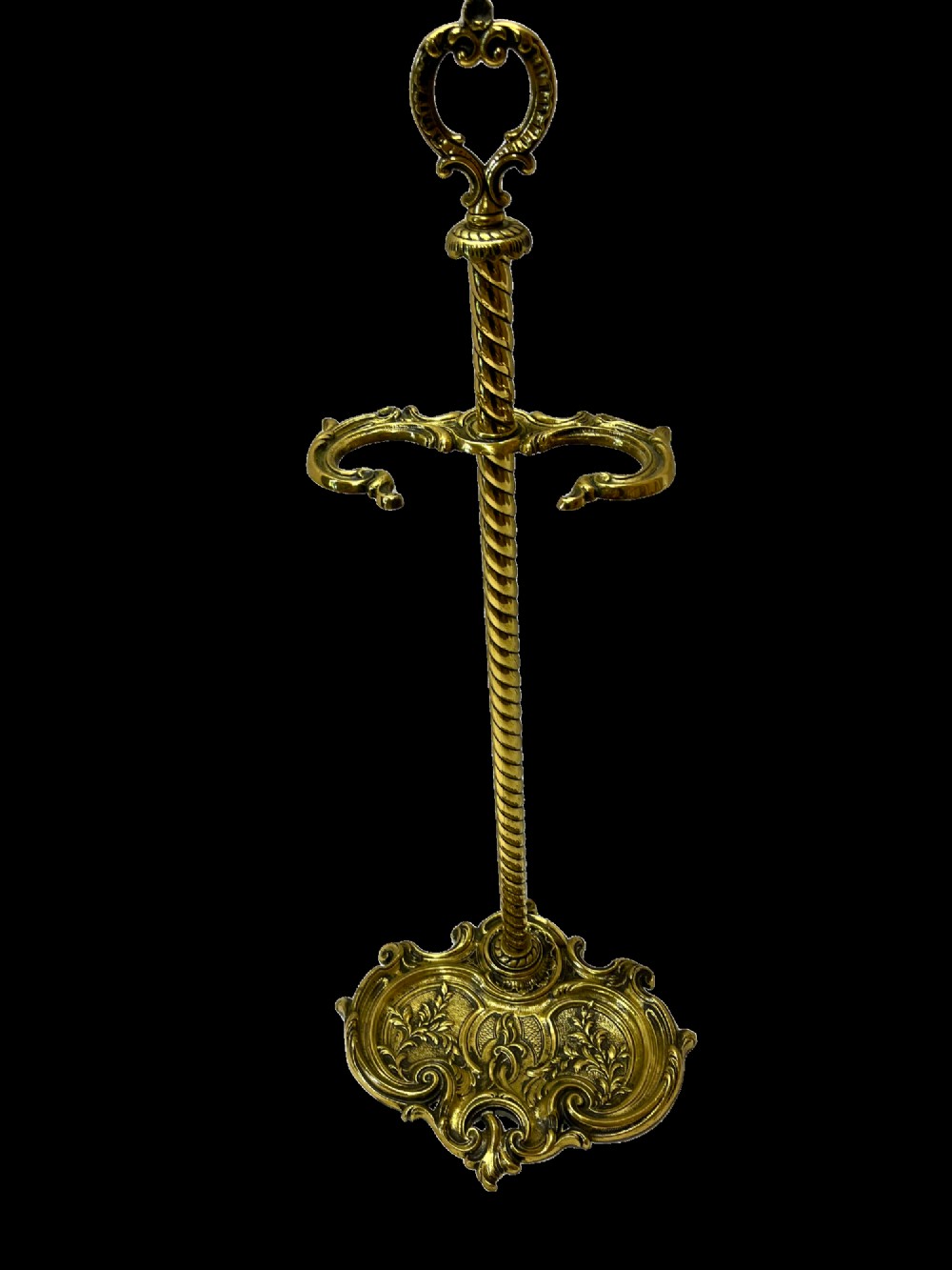 An ornate brass fire iron tidy featuring a detailed scrollwork base, a twisted central column, dual hanging hooks, and an ornamental top handle. View II