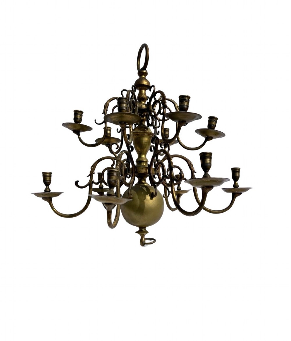 A late nineteenth-century multi-arm brass chandelier featuring scrolling candle branches, a central baluster stem, and a spherical base globe. View IV