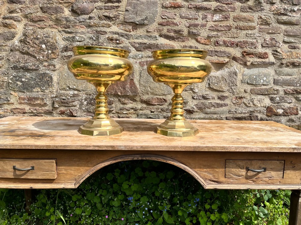 A pair of polished brass goblets featuring wide rounded bowls, turned baluster stems, and octagonal bases. View IV