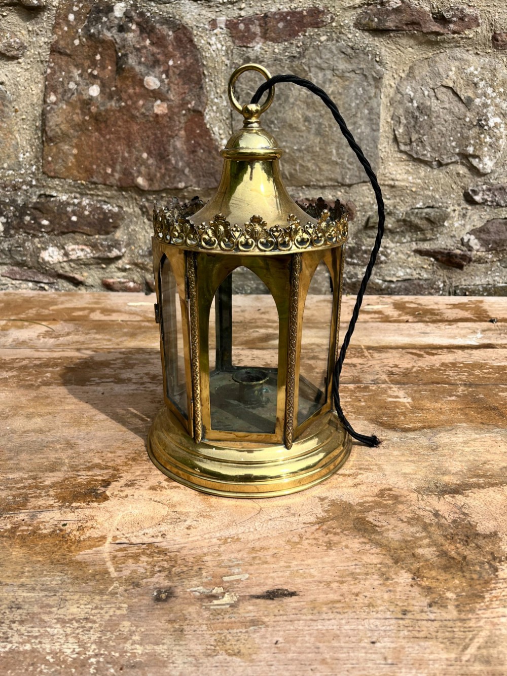 An electrified antique brass hall lantern featuring arched glass panels, a pierced top gallery, and a domed canopy with hanging loop. View III