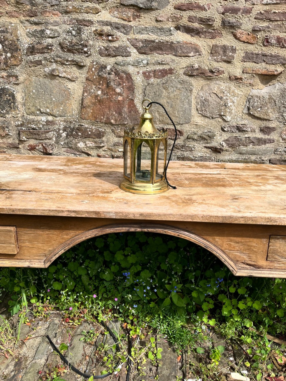 An electrified antique brass hall lantern featuring arched glass panels, a pierced top gallery, and a domed canopy with hanging loop. View IV
