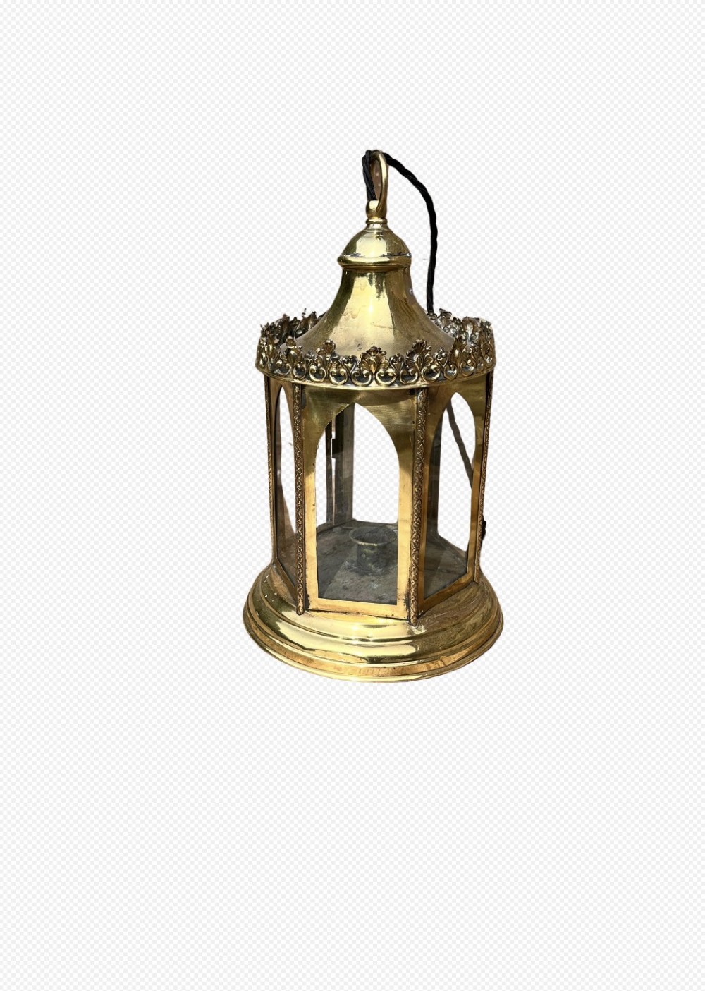 An electrified antique brass hall lantern featuring arched glass panels, a pierced top gallery, and a domed canopy with hanging loop.