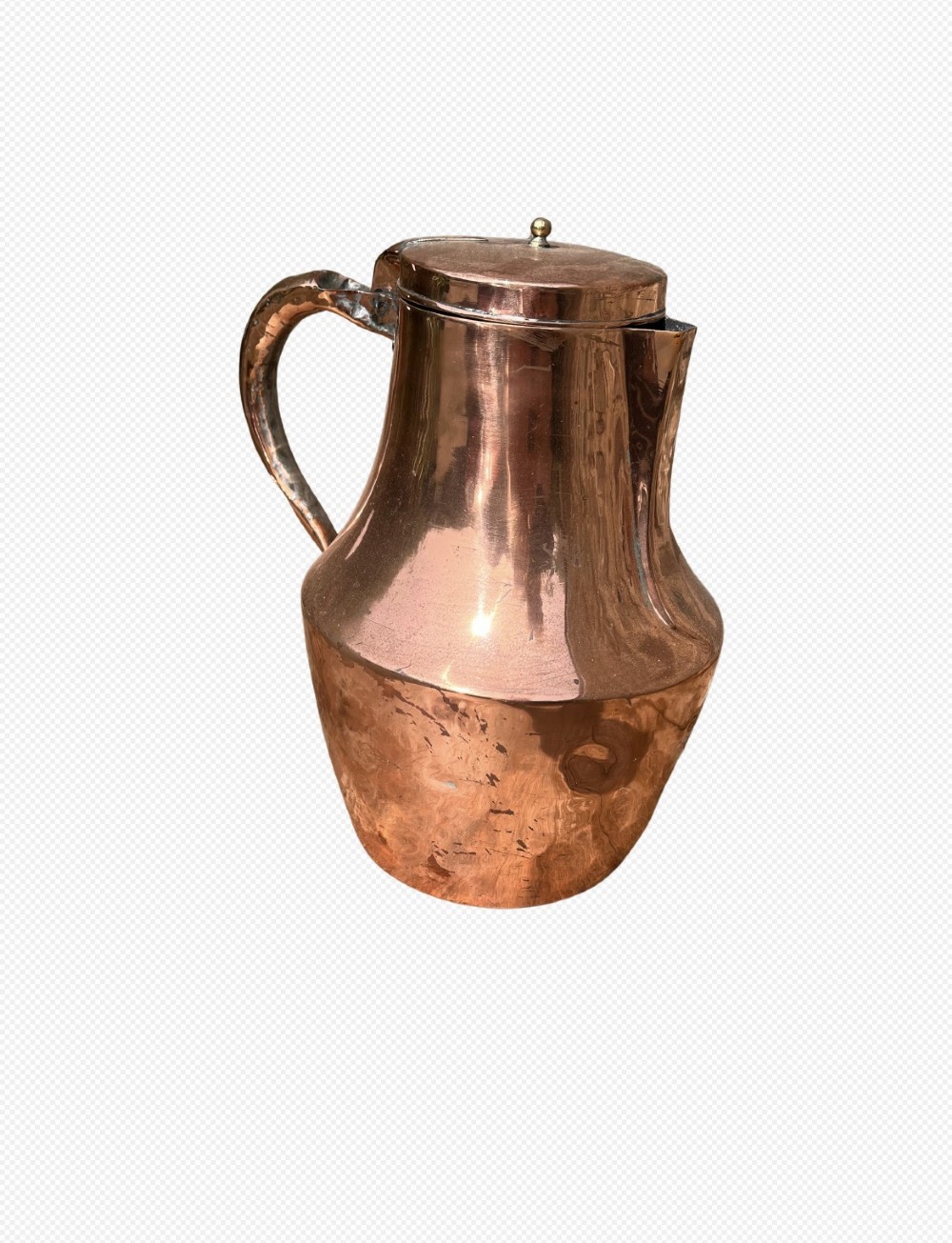 A polished antique copper milk jug featuring a hinged lid, small top finial, and a broad curved handle.