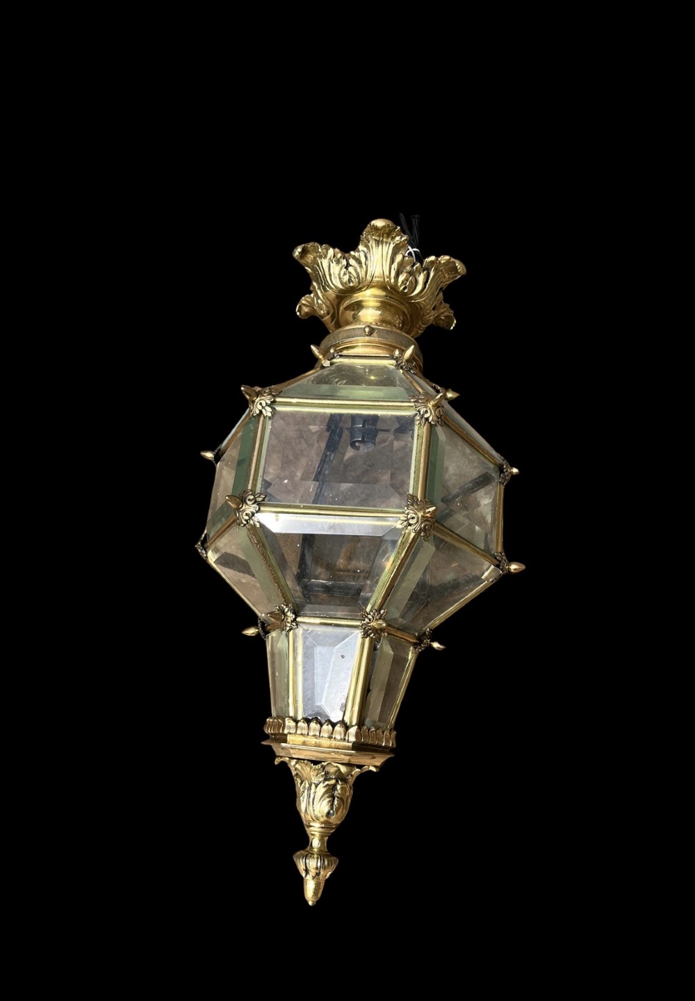 An ornate Versailles style French brass hanging lantern featuring bevelled glass panels, cast metal mouldings, and a leaf motif crown. View II