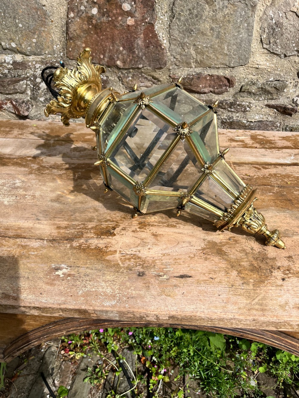 An ornate Versailles style French brass hanging lantern featuring bevelled glass panels, cast metal mouldings, and a leaf motif crown. View IV