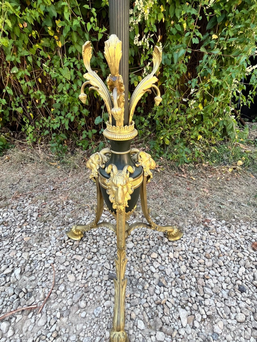 A Victorian gilt bronze and black patinated metal standard floor lamp with a lion mask urn top section, fluted shaft, and tripod paw feet. View IV
