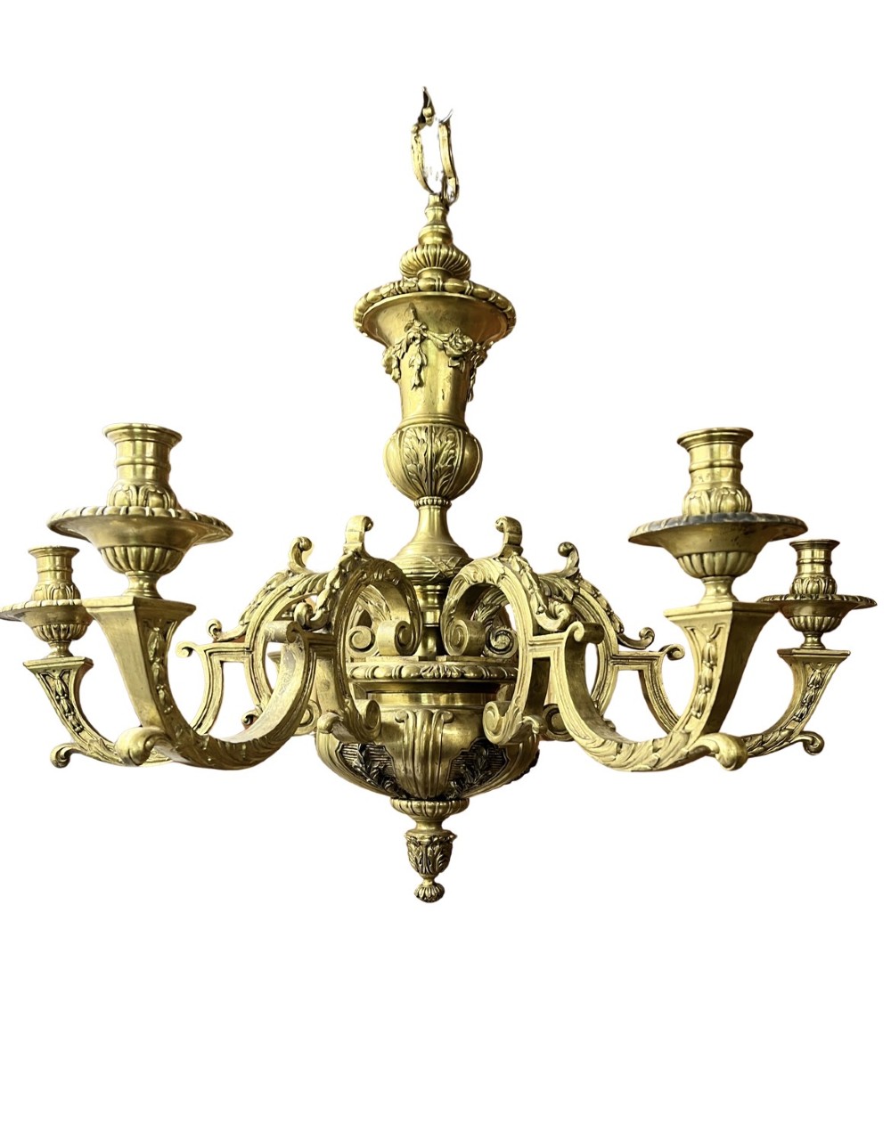 A Georgian style cast brass chandelier featuring a central urn-shaped column, ornate scroll arms, and candle-style sconces with acanthus leaf decoration.