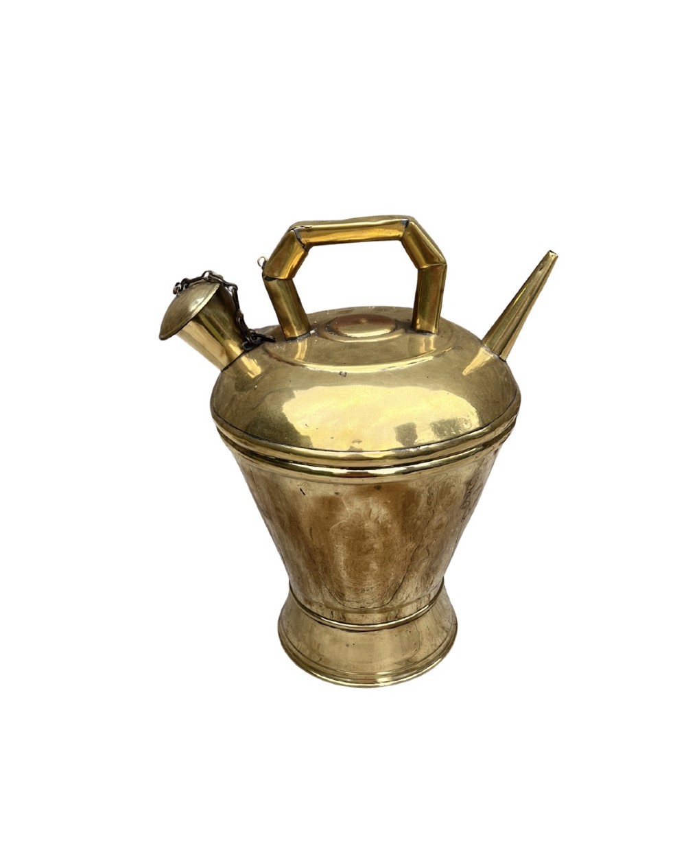 An antique polished brass oil vessel featuring an angular top handle, a long thin pouring spout, and a capped filler spout on a pedestal base.