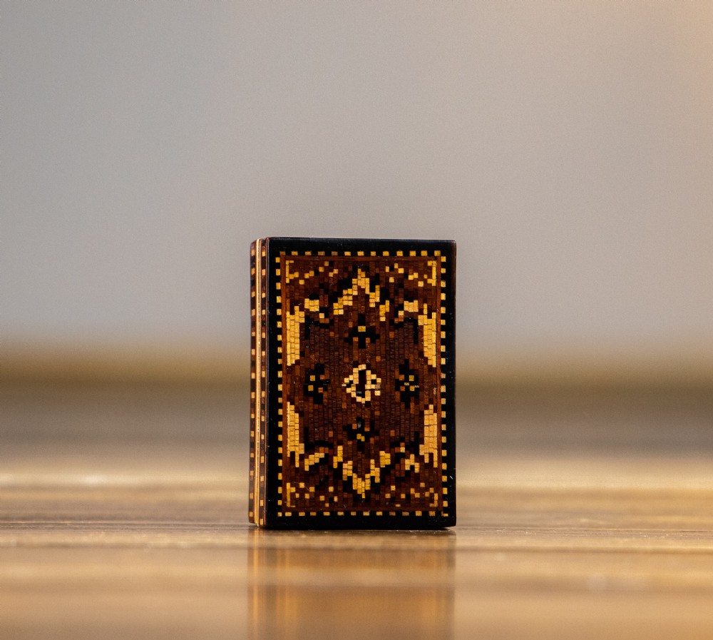 Small rectangular Victorian Tunbridge ware box featuring a complex geometric mosaic wood inlay pattern on the lid.