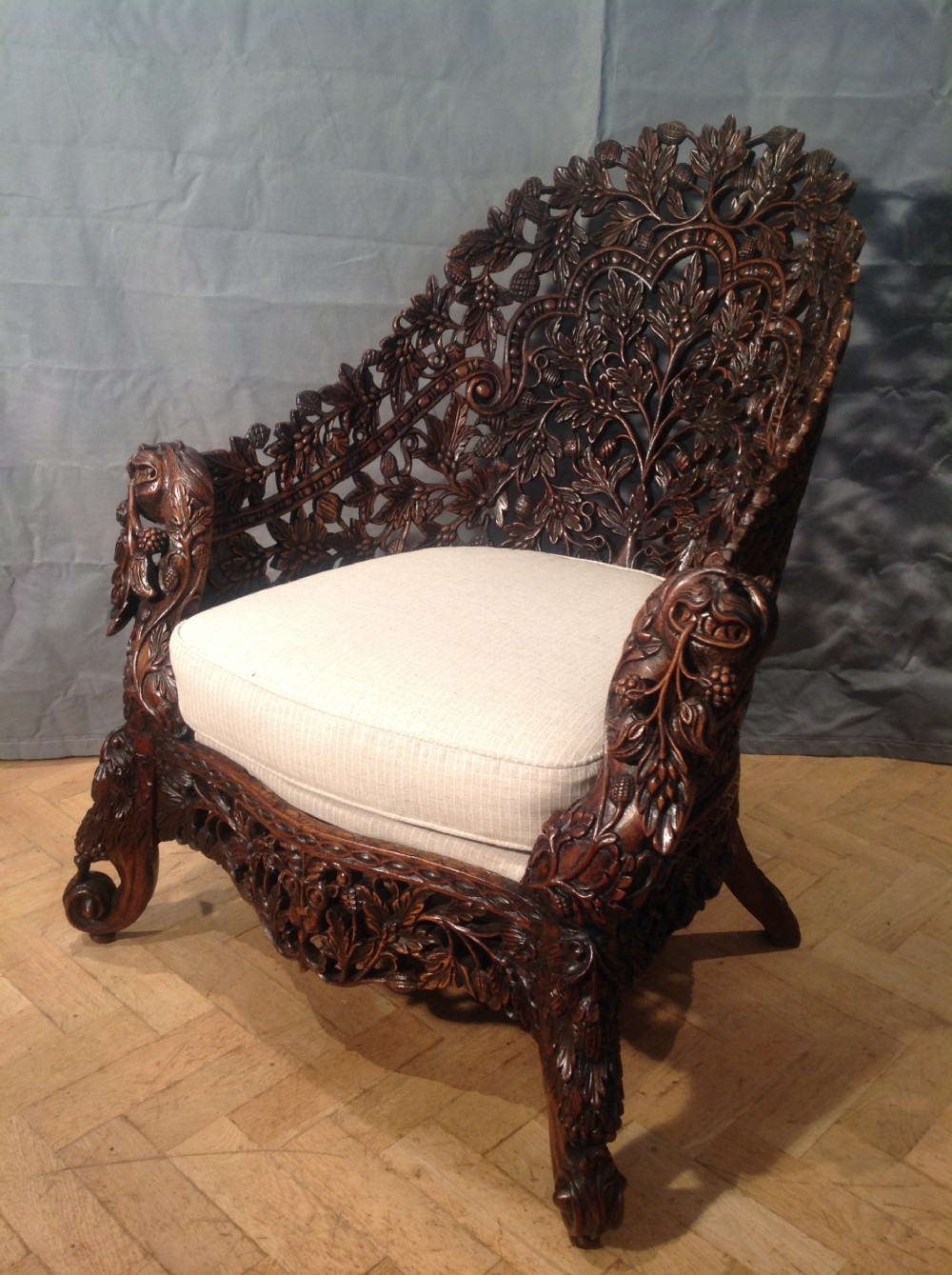 Indian high backed carved easy chair