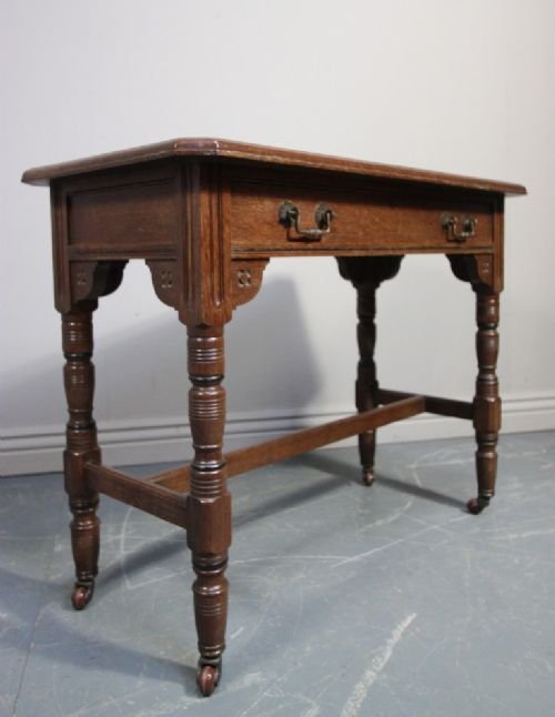 Antique Oak Writing Table by Lambs of Manchester.