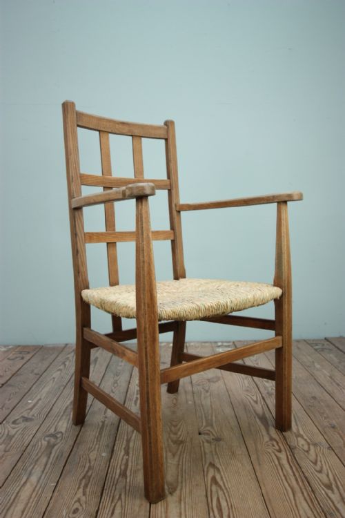 English Antique Oak Armchair by Heals.
