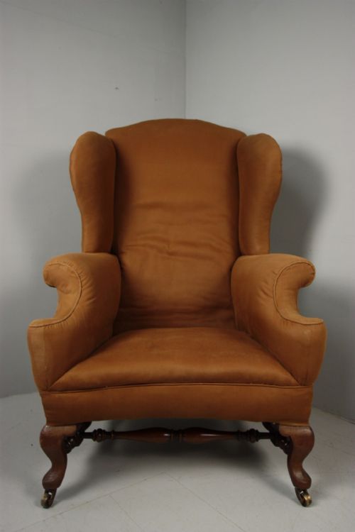 fig 1. Edwardian Howard & Sons Antique Wing Armchair .