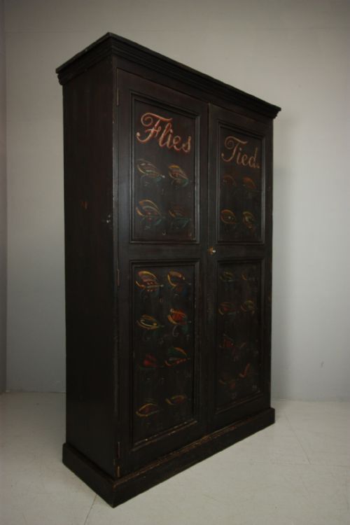 Antique Pine Cupboard Decorated with Fishing Flies.