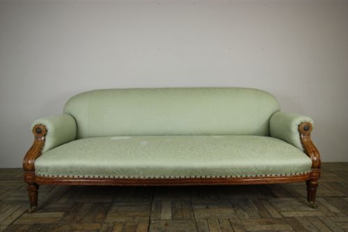 English 19th Century Upholstered Antique Oak Sofa.