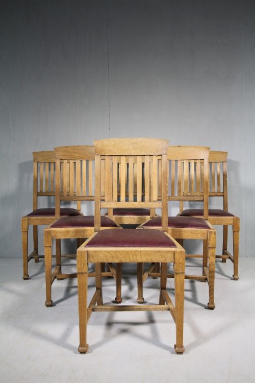 Set of Eight Antique Oak Dining Chairs by Warings of London.
