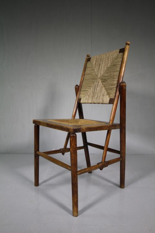 Antique Chair by Ambrose Heal.
