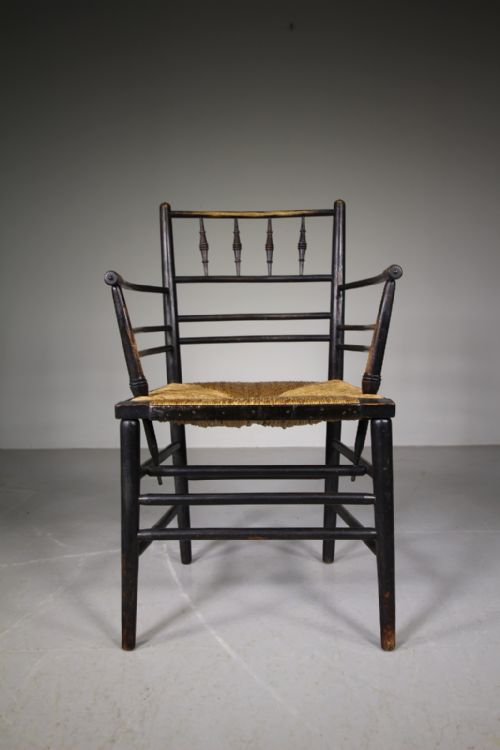 A True 19th Century Ebonised Antique Sussex Chair by William Morris