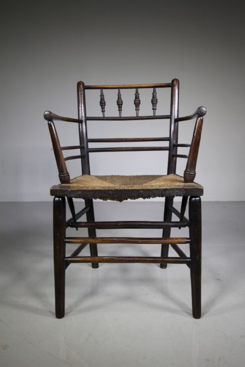 A True 19th Century Ebonised Antique Sussex Chair by William Morris