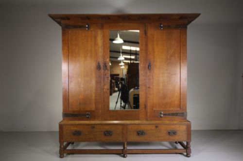 

Superb Large Heals of London 19th Century Newlyn Oak Antique Wardrobe-splits Up