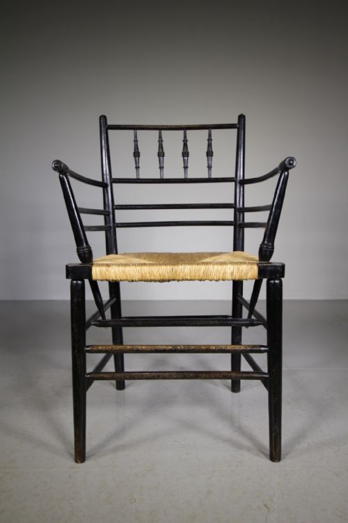 A True 19th Century Ebonised Antique Sussex Chair by William Morris