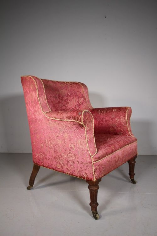 Ample English 19th Century Antique Upholstered Barrel Back Armchair
