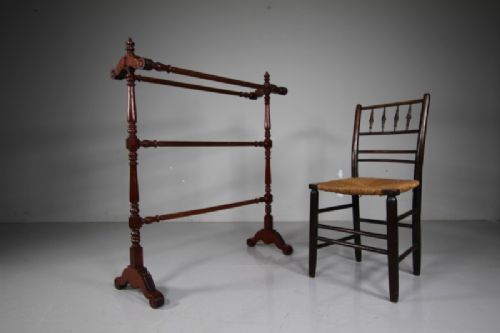 A freestanding mahogany towel rail featuring turned upright columns, finials, carved scroll feet, and multiple horizontal crossbars. View III