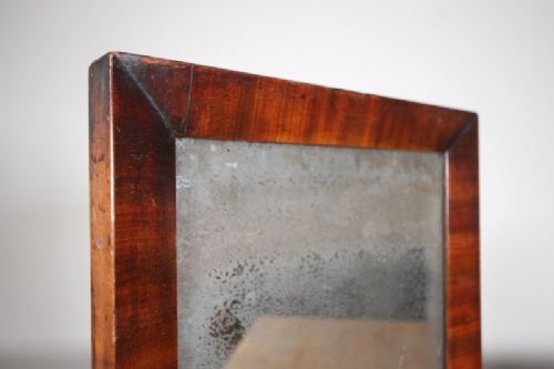 An 18th-century rectangular wall mirror featuring a rich mahogany frame with mitred corners and an oxidised glass plate. View III