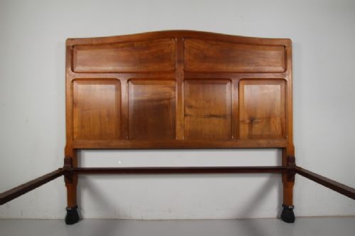 A 1920s pale walnut double bed frame featuring framed panelwork on both the headboard and footboard. View III