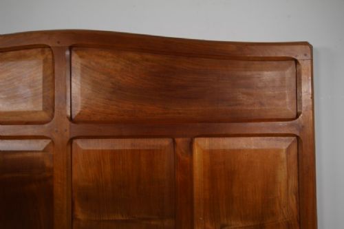 A 1920s pale walnut double bed frame featuring framed panelwork on both the headboard and footboard. View IV