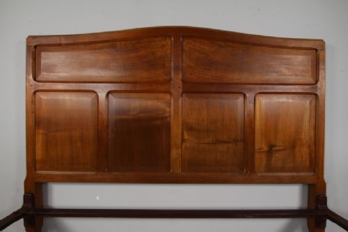 A 1920s pale walnut double bed frame featuring framed panelwork on both the headboard and footboard. View V