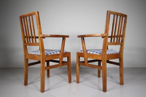 A pair of 1930s solid oak open armchairs featuring vertical slat backs, flattened armrests, and blue and white checked upholstered seats. View III