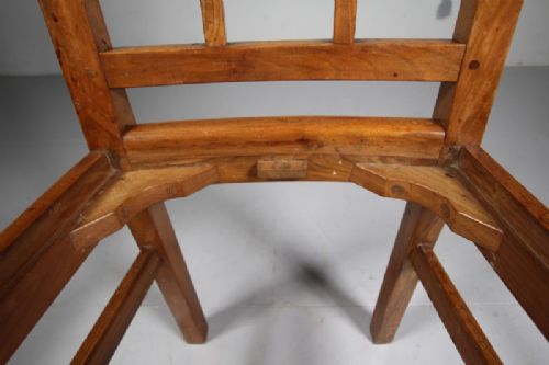 A pair of 1930s solid oak open armchairs featuring vertical slat backs, flattened armrests, and blue and white checked upholstered seats. View V