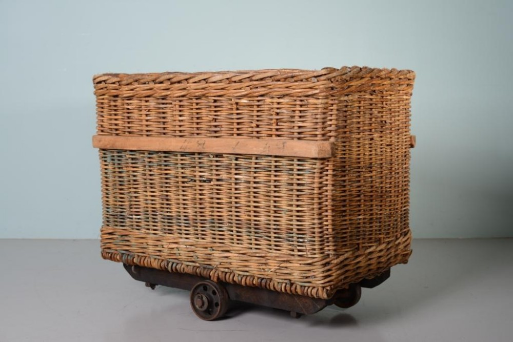 Antique Wicker Mill Basket on Cast Iron Wheels