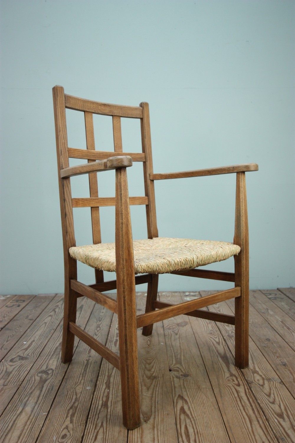 English Antique Oak Armchair by Heals.