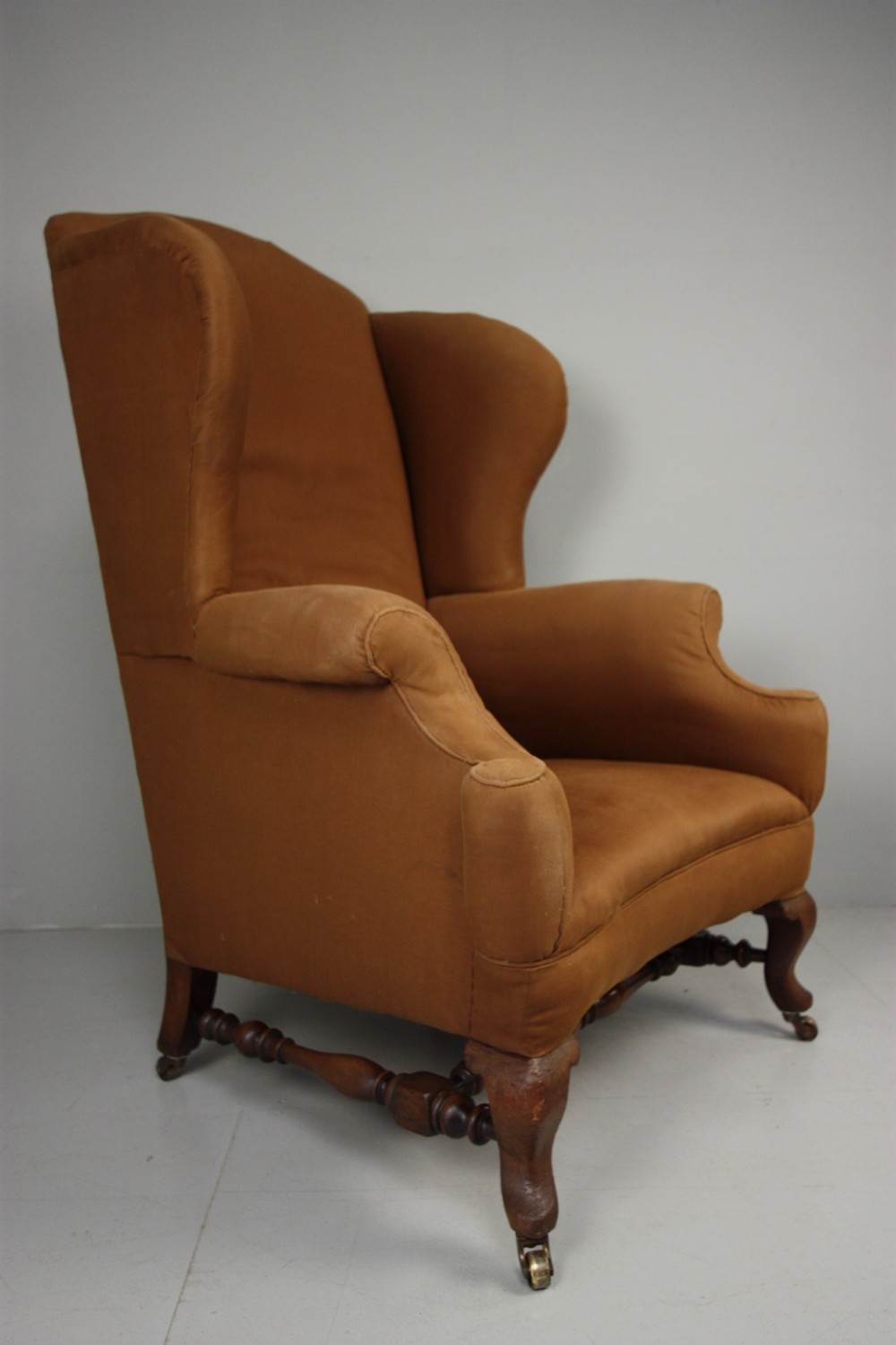 Edwardian Howard & Sons Antique Wing Armchair .