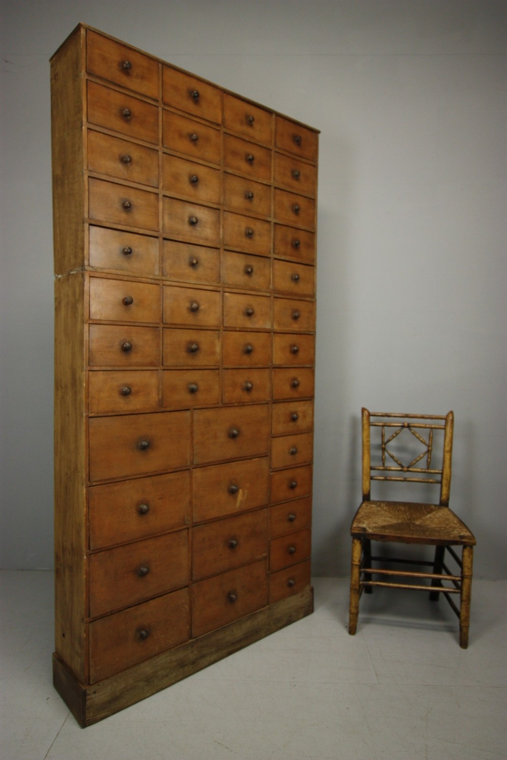 Tall 19th Century Antique Bank of Drawers in Paint.