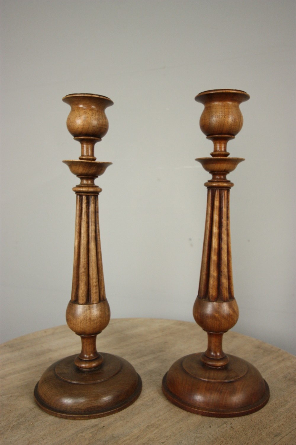 Pair of English Antique Walnut Candlesticks.