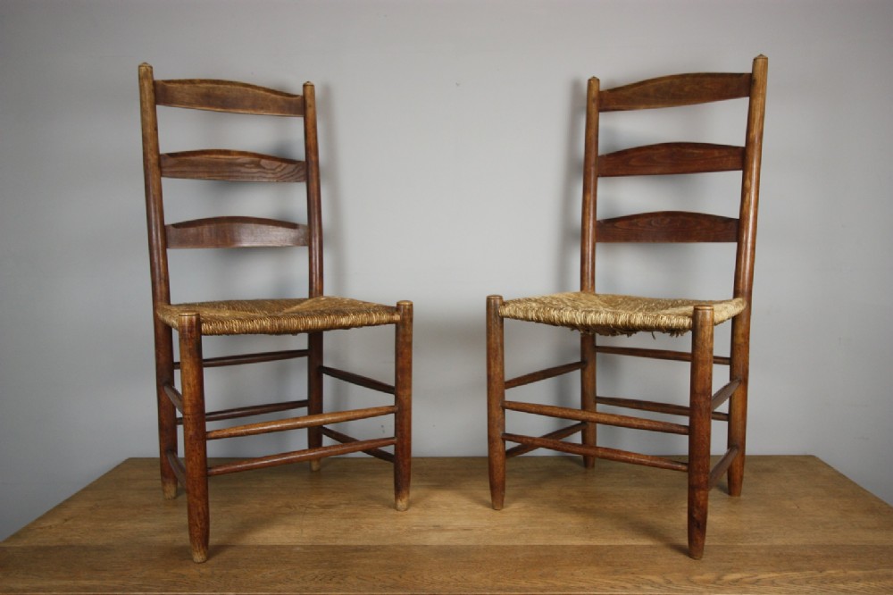 Pair of Gimson Antique Ladderback Chairs in Elm.