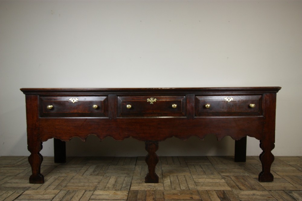 English 18th Century Antique Oak Silhouette Dresser. 