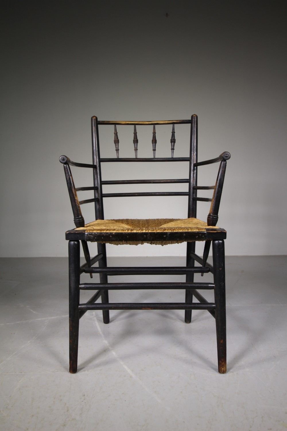 A True 19th Century Ebonised Antique Sussex Chair by William Morris