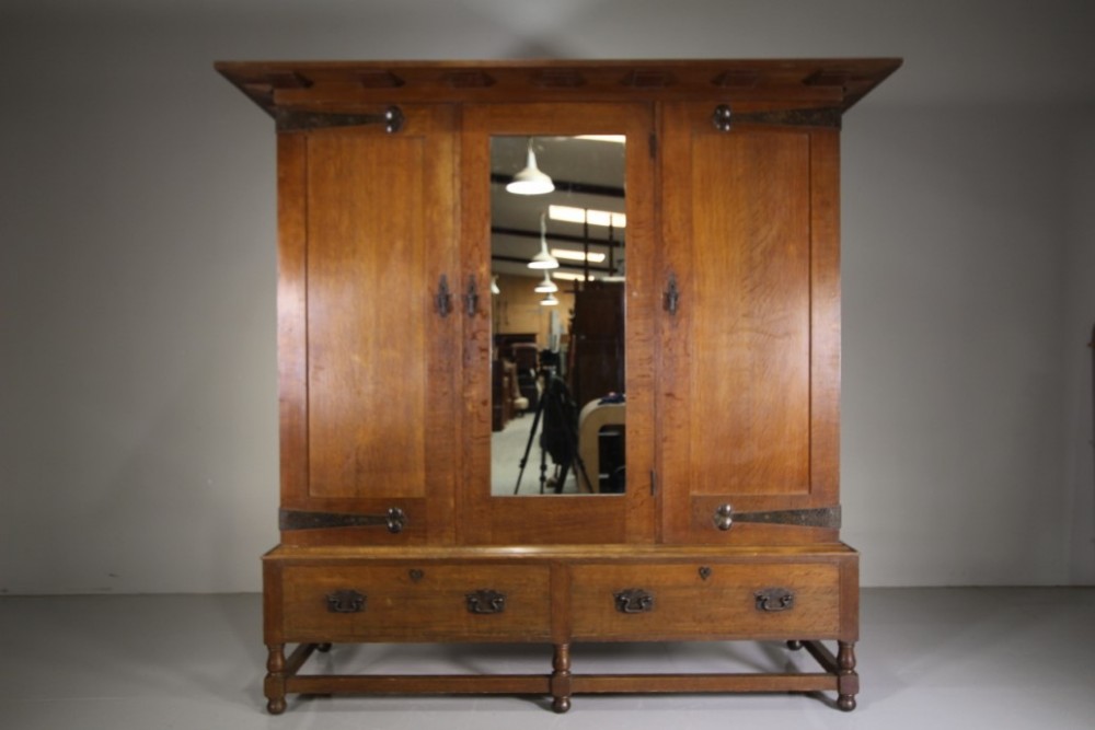 

Superb Large Heals of London 19th Century Newlyn Oak Antique Wardrobe-Splits Up