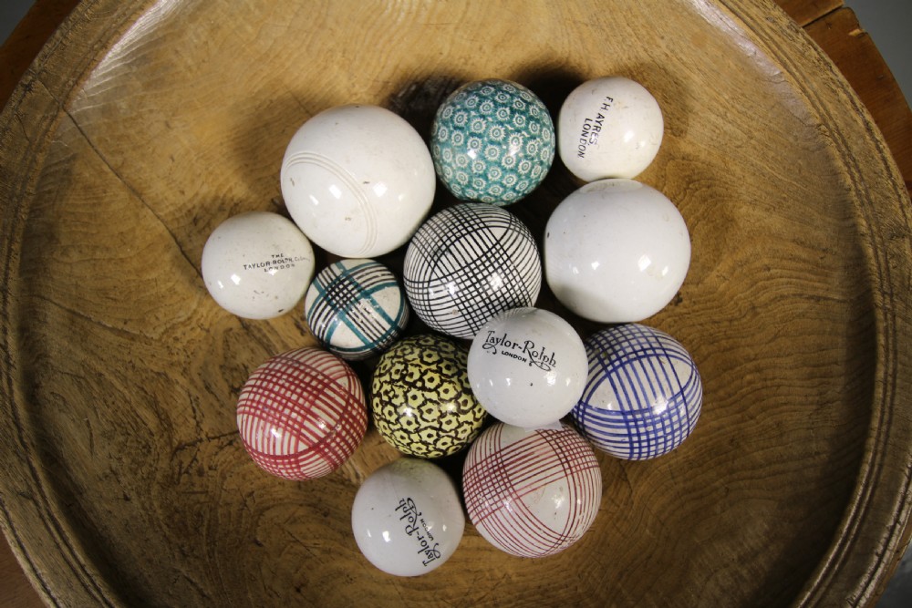 A collection of nineteenth-century ceramic carpet balls featuring various glazed patterns and colours. View V