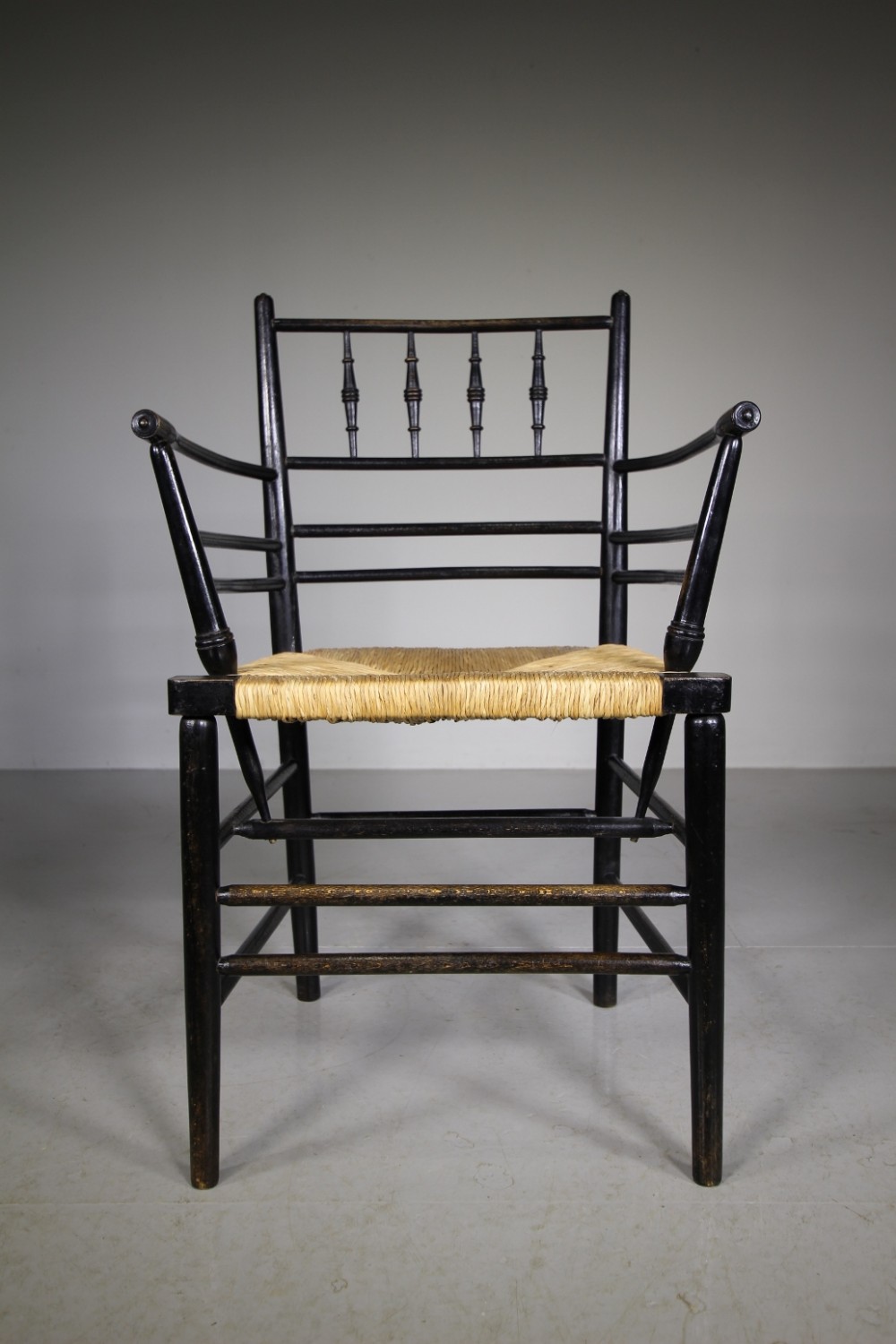 A True 19th Century Ebonised Antique Sussex Chair by William Morris