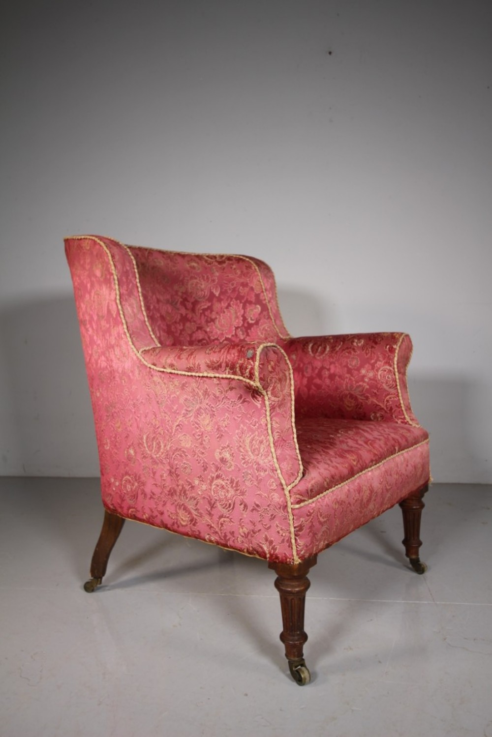 Ample English 19th Century Antique Upholstered Barrel Back Armchair