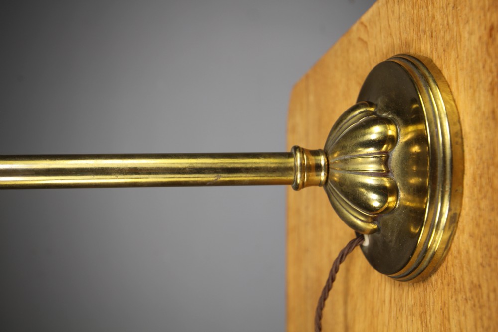 An antique brass Edwardian reading lamp featuring a sweeping curved swan-neck stem, fluted circular base, and braided brown flex cable. View II