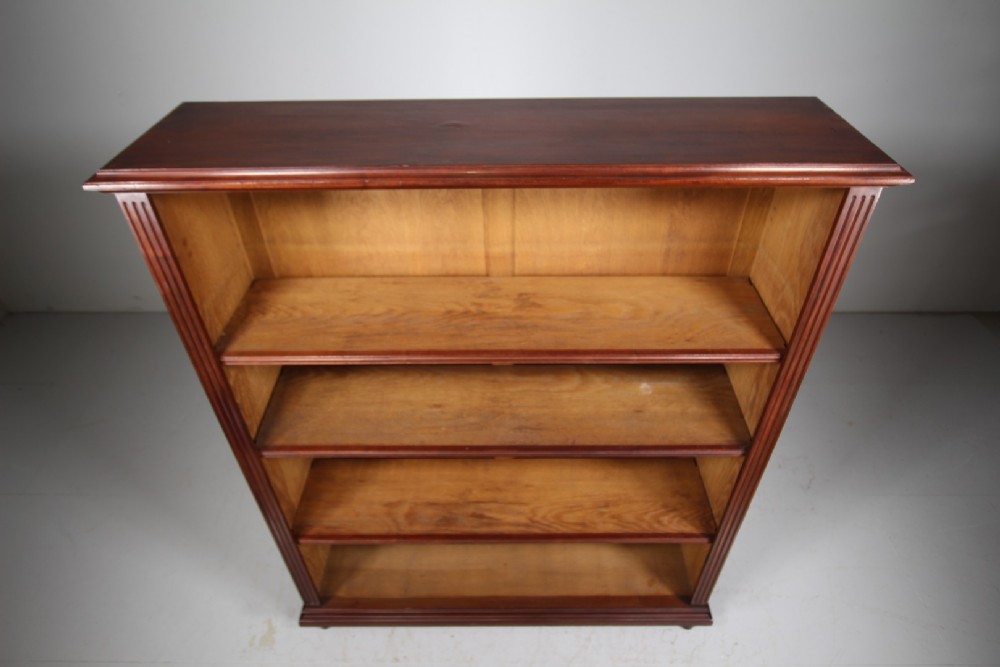 A large 19th-century mahogany open bookcase featuring diamond parquetry side panels, panelled backboards, four shelf sections, and turned feet. View III